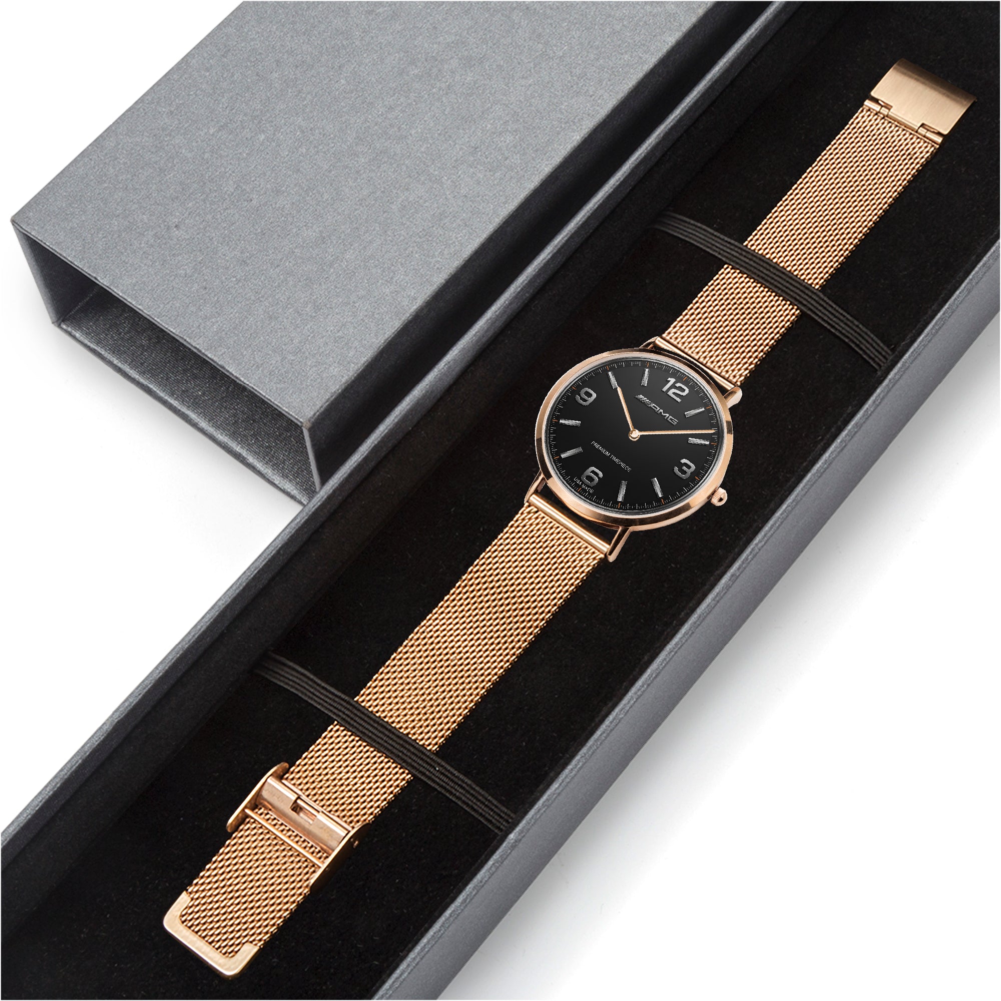 Rose gold watch with black dial in a gray box