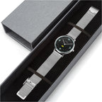 Silver watch with a colorful face in a gray box