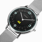 A Petronas wristwatch with a silver stainless steel mesh strap and a black dial featuring a star pattern, white Arabic numerals, and a bright yellow '44' on the center.