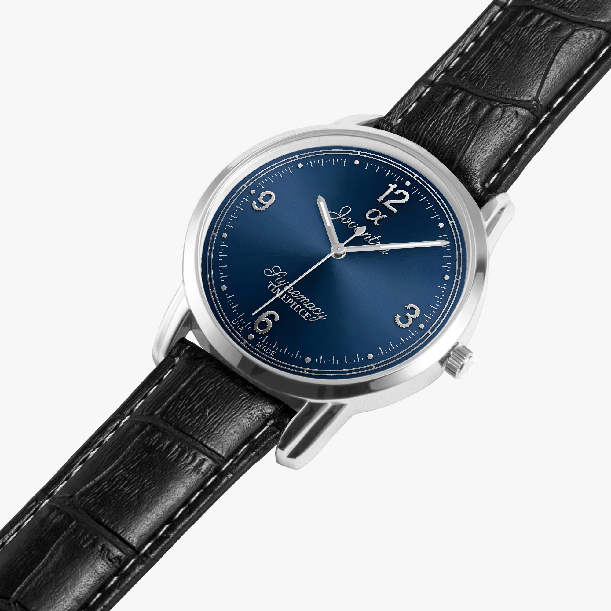 A luxury watch with a round silver-tone case, a deep blue dial featuring white Arabic numerals and script branding, and a black alligator-textured leather strap, shown on a light gray background.