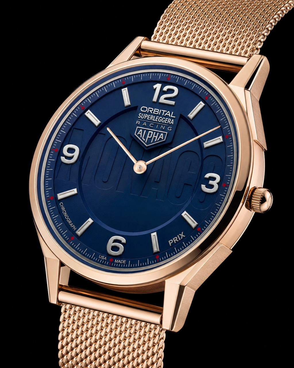 A close-up studio shot of a wristwatch with a rose gold-toned case and mesh band, featuring a deep blue dial with white Arabic numerals and the ALPHA logo.