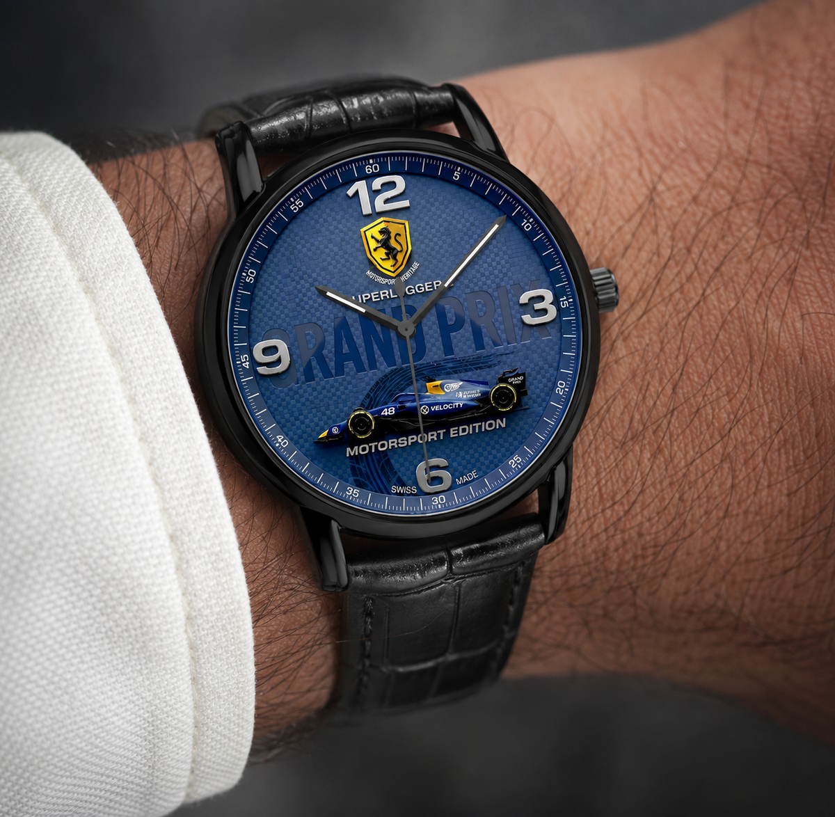 A close-up of a wrist wearing a black leather Joventra Grand Prix watch with a blue racing-themed dial. The dial features a racing emblem, large white numerals, and a small blue racing car graphic near the bottom, with 'MOTORSPORT EDITION' text.