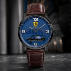 A wristwatch with a blue racing-themed dial, featuring a leopard logo and a Formula 1 car graphic, paired with a brown leather strap. The watch is presented on a dark, textured surface with a blurred background.