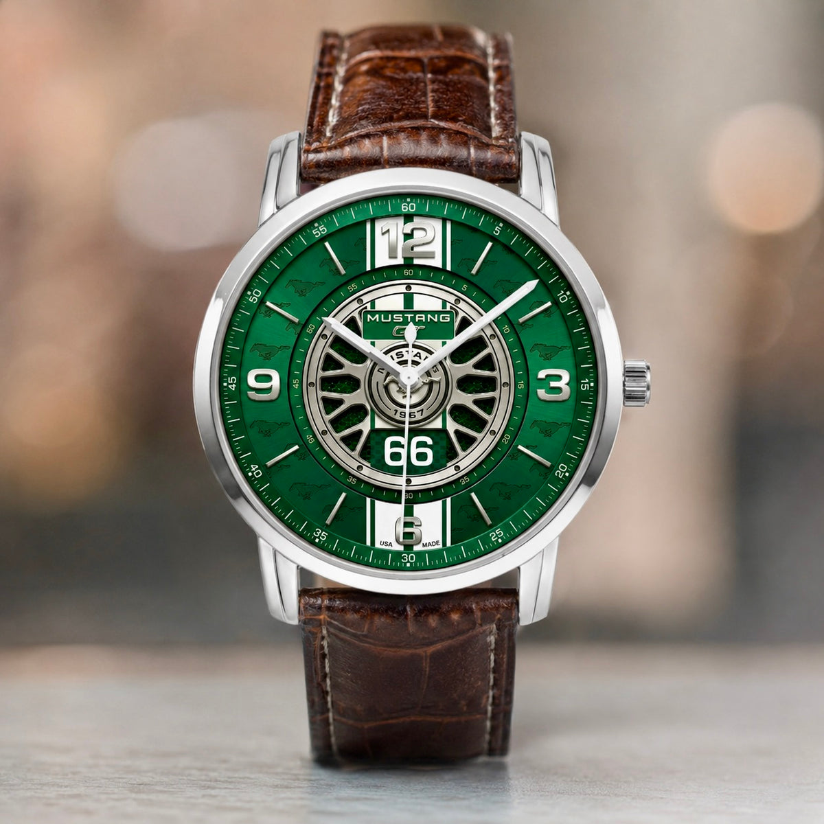 Joventra 1967 GT watch dial featuring a racing green sunburst finish, white rally stripes, wheel rim motif, and number 66.