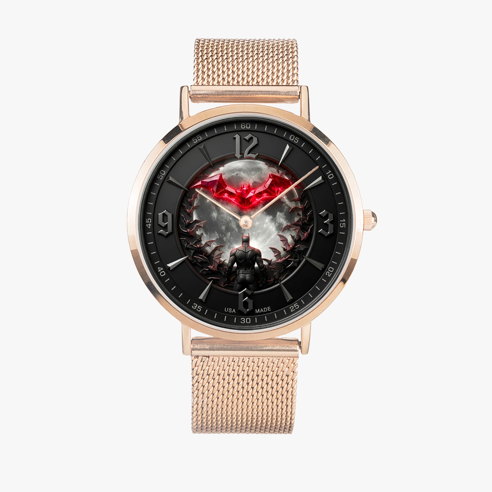 A rose gold mesh-strand watch with a round black dial featuring a red bat logo and a dark fantasy character illustration, shown against a light gray background.