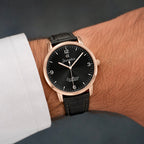 Close-up view of Joventra Excellence black watch dial featuring sunburst finish, silver numerals, and Joventra Alpha logo