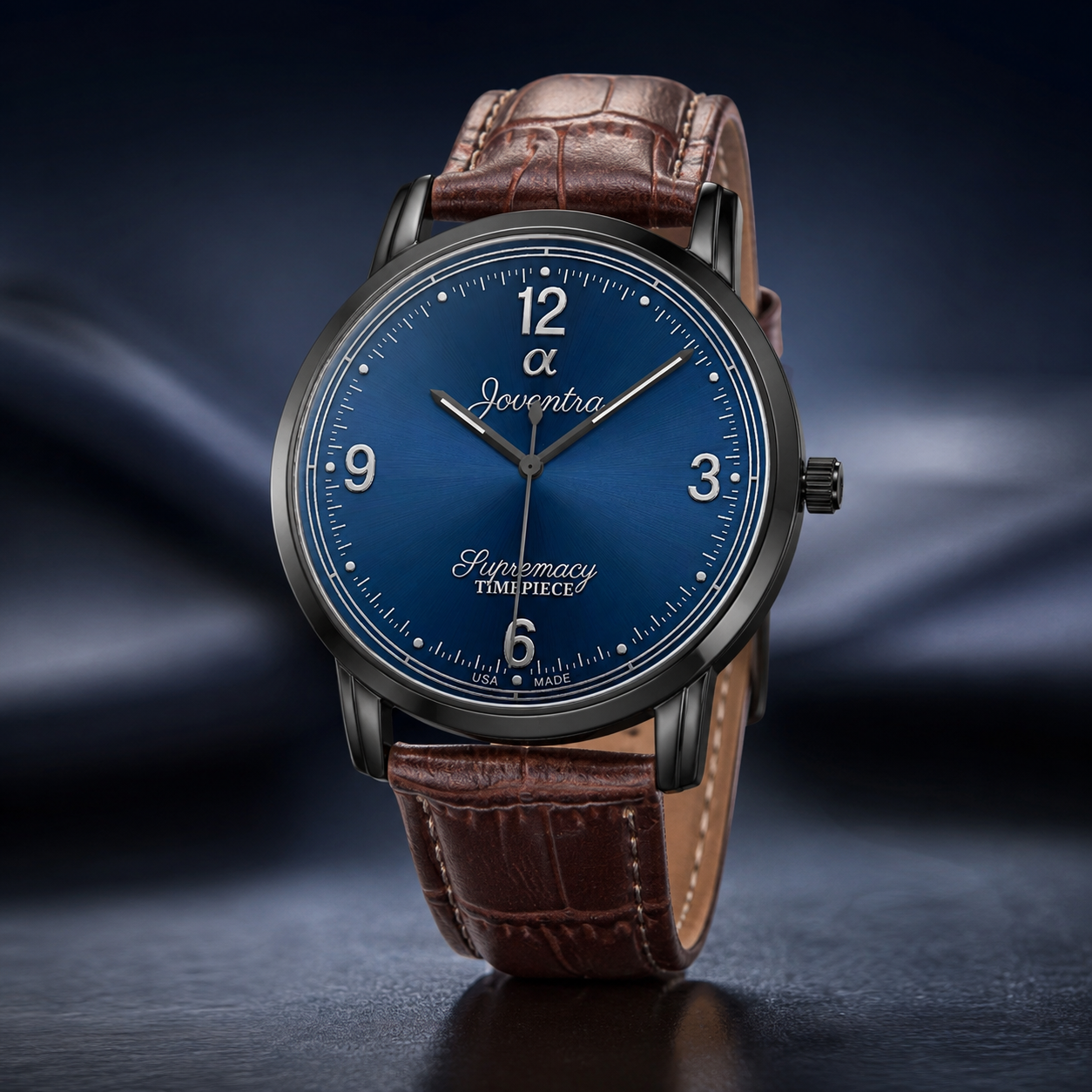 A luxury wristwatch with a round blue dial, silver-tone case, and brown leather strap, shown on a dark reflective surface with a smoky blue background.