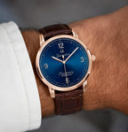 Joventra Supremacy Alpha sunburst blue watch in silver stainless steel case with black alligator-embossed leather strap.