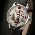 A wristwatch with a silver-toned case, a black leather strap, and a detailed Popeye the Sailor themed dial. The dial features red numerals, a nautical illustration with an anchor, sailboat, lighthouse, and Popeye character, and the text 'Popeye the Sailor' and 'Est.