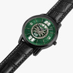 A wristwatch with a black leather strap, a black case, and a green dial featuring a vintage wheel design and white numerals, shown on a light gray background.
