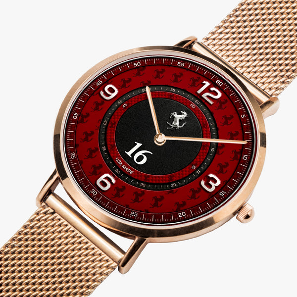 A luxury watch featuring a rose gold mesh strap, a round rose gold case, and a red dial with black and red racing-inspired graphics, white Arabic numerals, and a black 16 o'clock sub-dial.