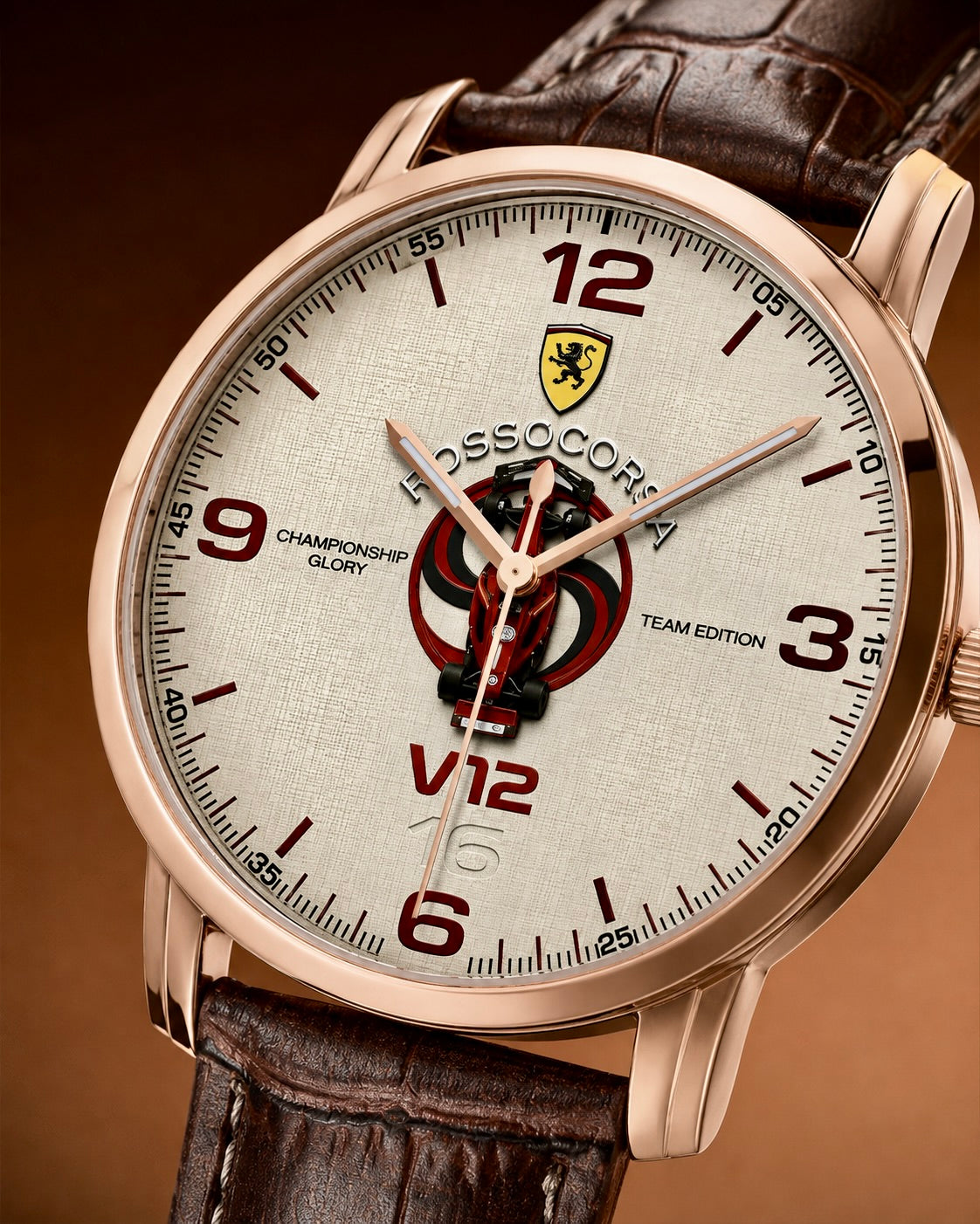 A close-up of a Joventra Rosso Corsa V12 watch with a rose gold case, textured off-white dial, and brown leather strap. The dial features a racing emblem and a central Grand Prix graphic.