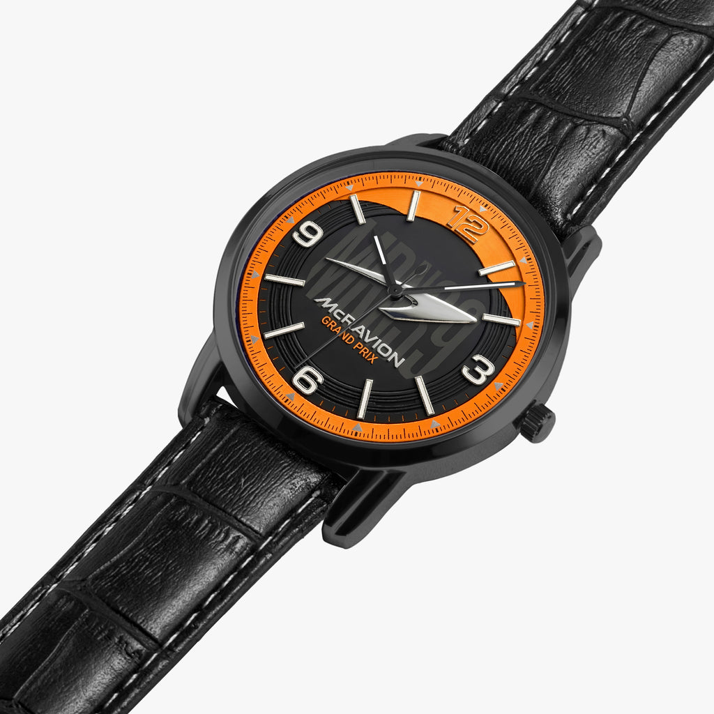 A black leather strap watch with a black dial, silver-tone hands and markers, and a bright orange inner ring, shown on a light gray background.