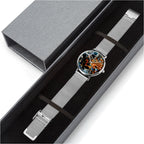 A silver stainless steel mesh watch with a black dial and a red graphic accent, presented inside a dark gray gift box.
