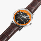 A wristwatch with a brown leather strap, a silver-toned case, and a black dial featuring a bright orange ring around the bezel. The brand name 'MCRAVION' is printed on the dial.