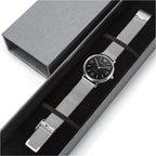 Silver watch with a colorful face in a gray box