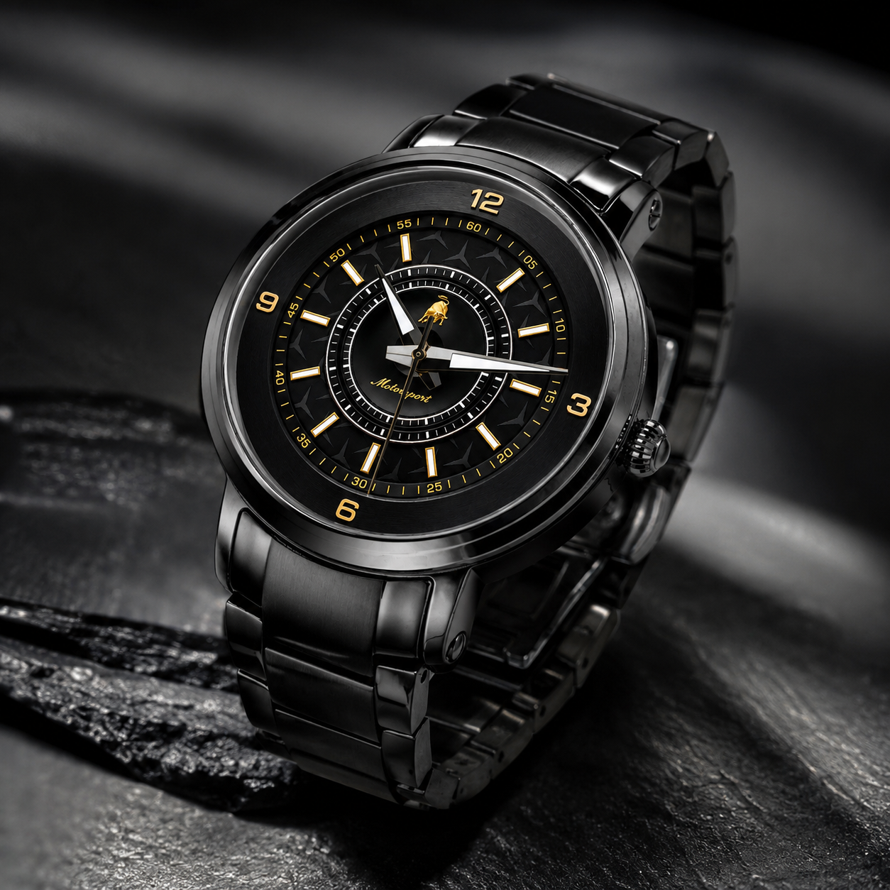 A black stainless steel men's watch with a matching black link bracelet, featuring a black dial with gold-tone hands, markers, and a small animal logo at the center.